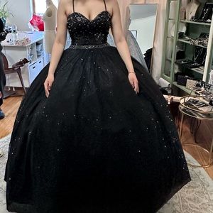 This is a black gown my daughter wore for her Sweet 16. It is a size two.